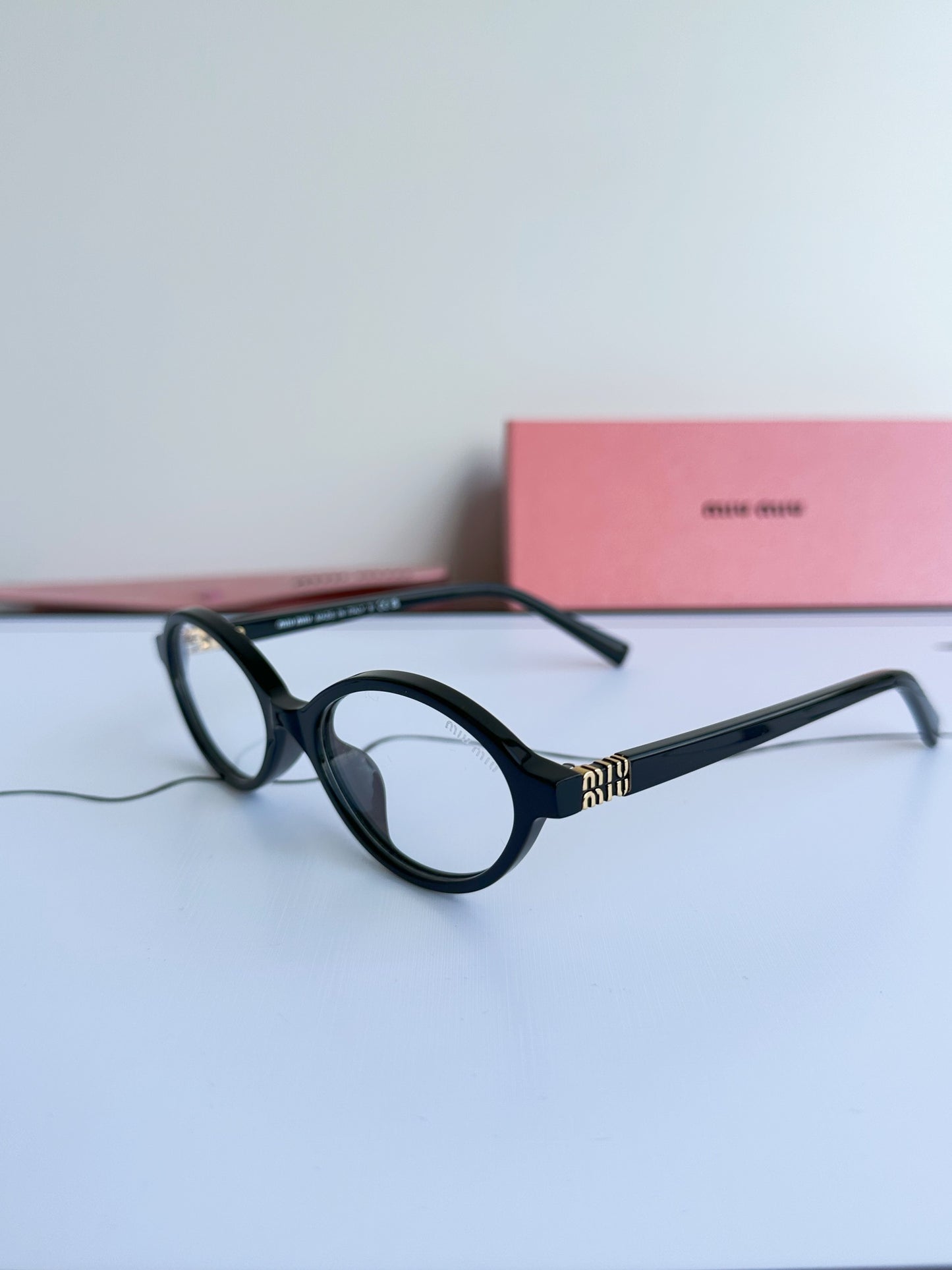 Miu Miu SMU04Z Black Frame Transparent Lens Sunglasses – 2023 Autumn/Winter Collection