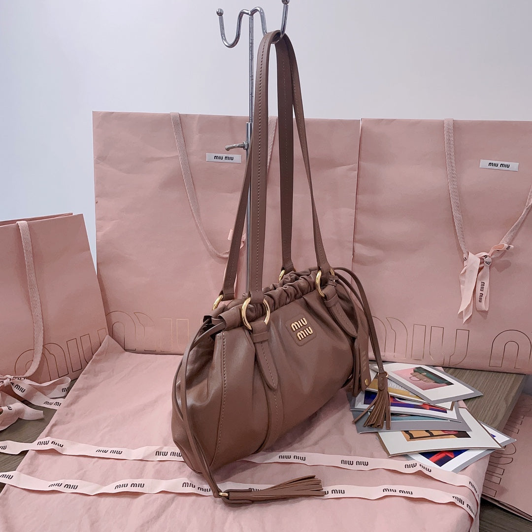 Miu Miu Tassel Drawstring Bucket Bag – New Collection