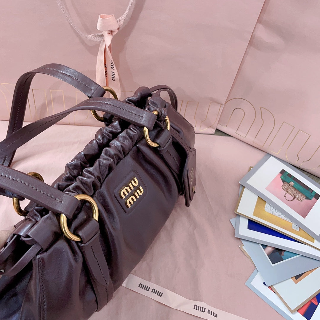 Miu Miu Tassel Drawstring Bucket Bag – New Collection