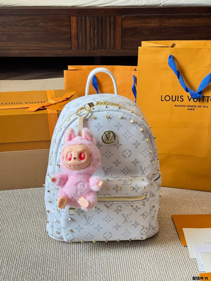 Louis Vuitton Monogram Mini Backpack in Monogram With Light Blue Charm