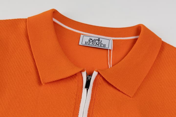 Hermès Retro Knitted Polo Shirt – SS24 in Black Polo With Orange Placket