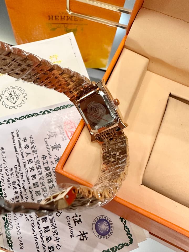 Hermès Small Square Luxury Watch in Dark Dial Patterned Gold Bracelet