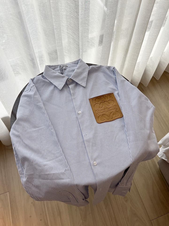 Loewe Embossed Logo Suede Pocket Striped Shirt in Tan Loewe Pouch, Light Blue Overshirt, Black Skirt - View 1