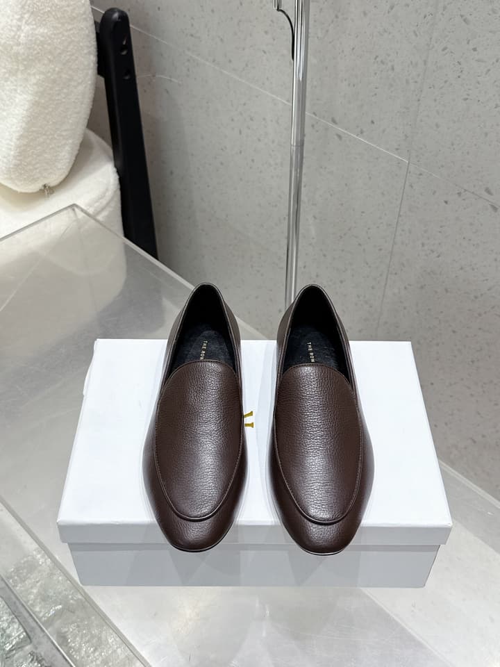 The Row Tassel Loafers in Black Suede