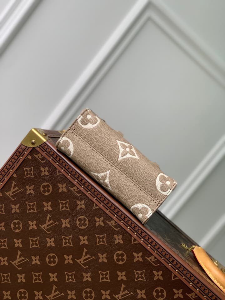 Louis Vuitton OnTheGo BB Monogram Empreinte Handbag in Beige And Cream Monogram