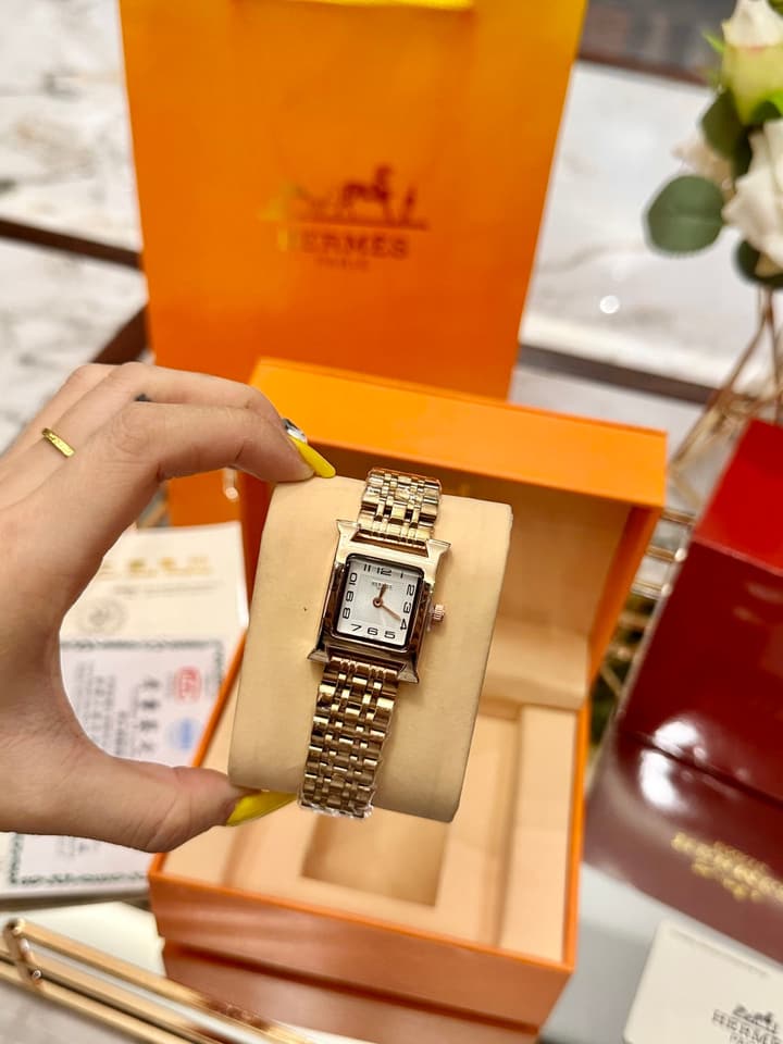 Hermès Small Square Luxury Watch in Dark Dial Patterned Gold Bracelet