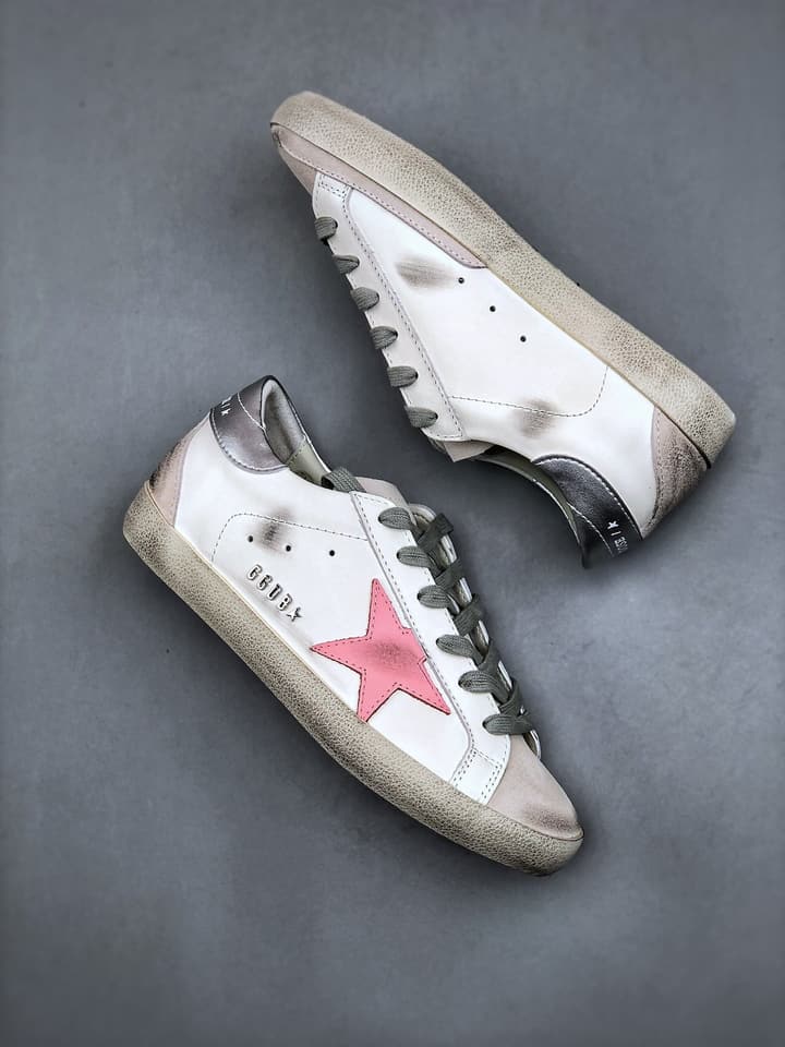 Golden Goose Distressed Sneakers in Gold