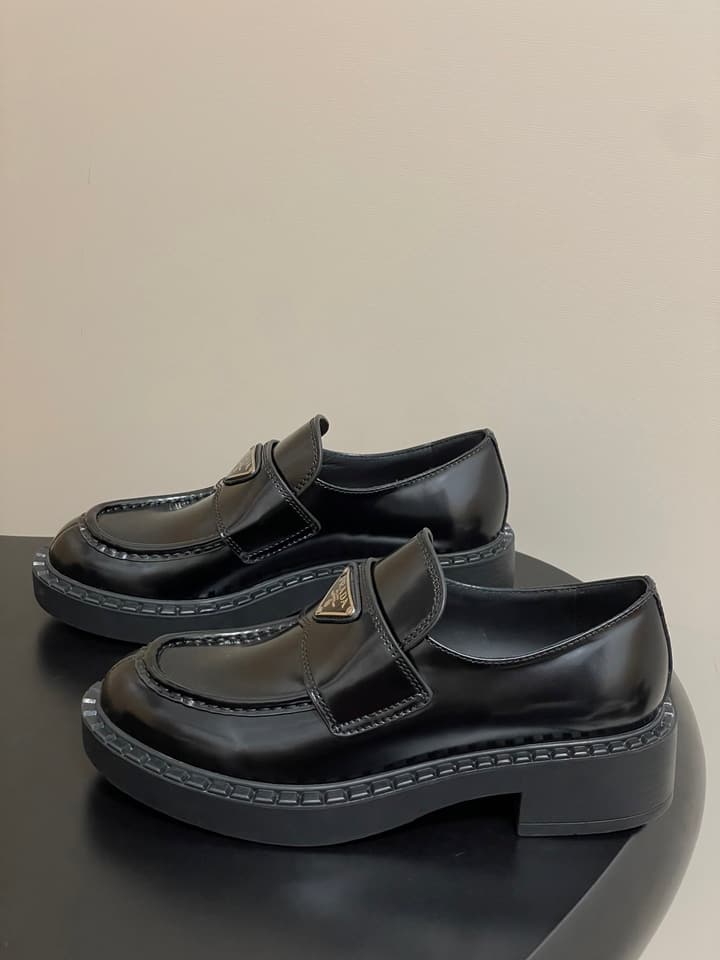 Prada Triangle Logo Platform Loafers in Black