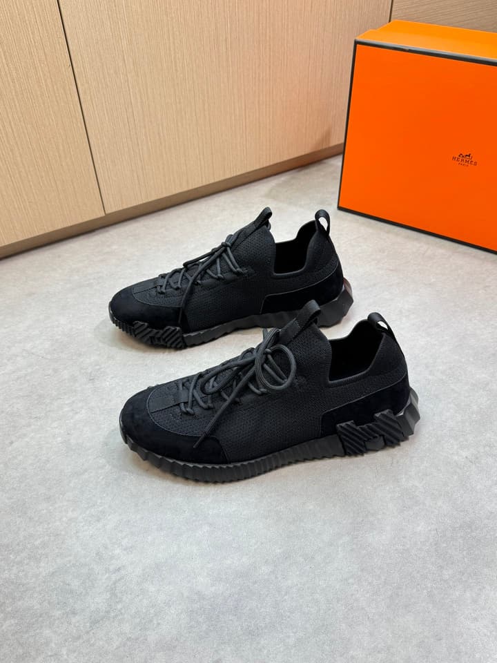 Hermès Casual Sports Sneakers in Black With White Laces And Orange Sole