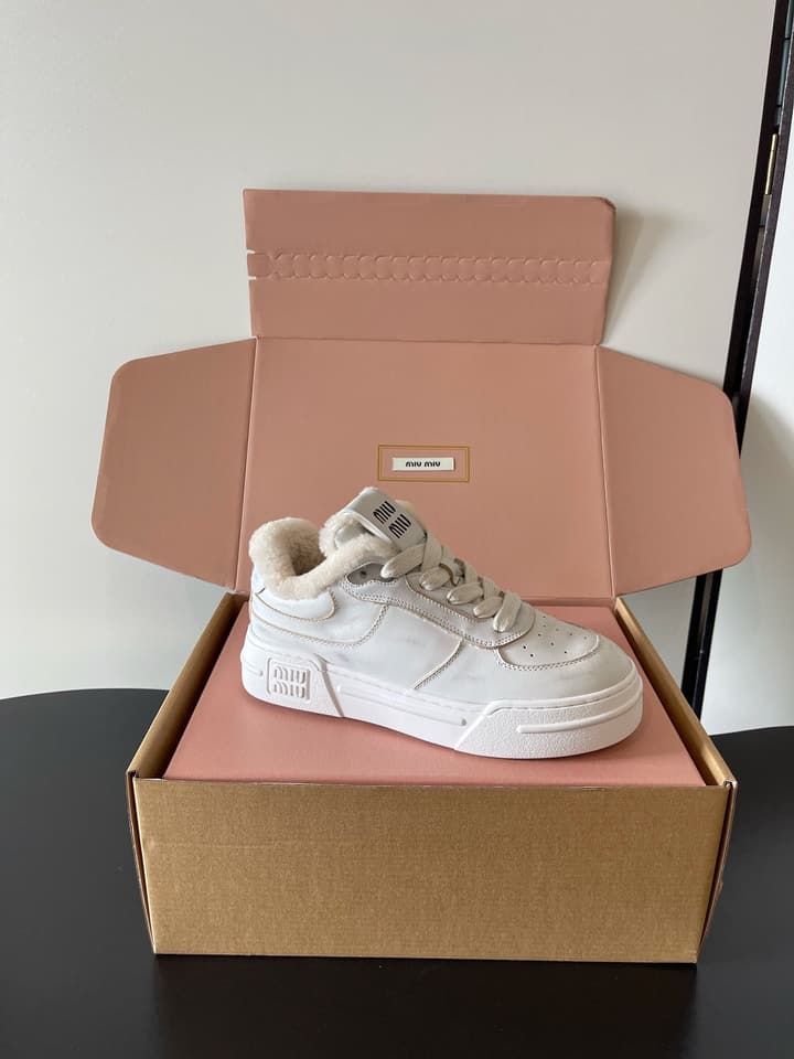 Miu Miu Distressed Retro German Training Sneakers in Distressed Off-white