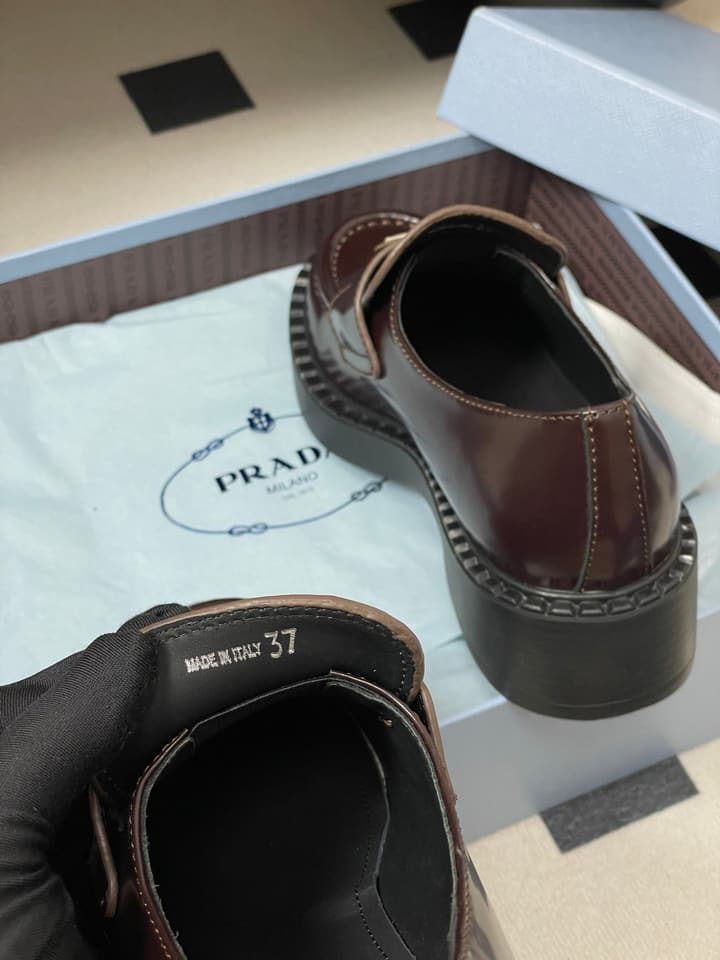 Prada Triangle Logo Platform Loafers in Black
