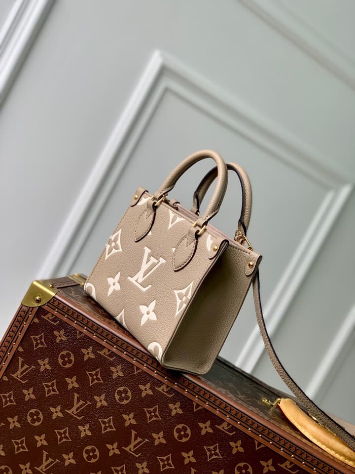 Louis Vuitton OnTheGo BB Monogram Empreinte Handbag in Beige And Cream Monogram