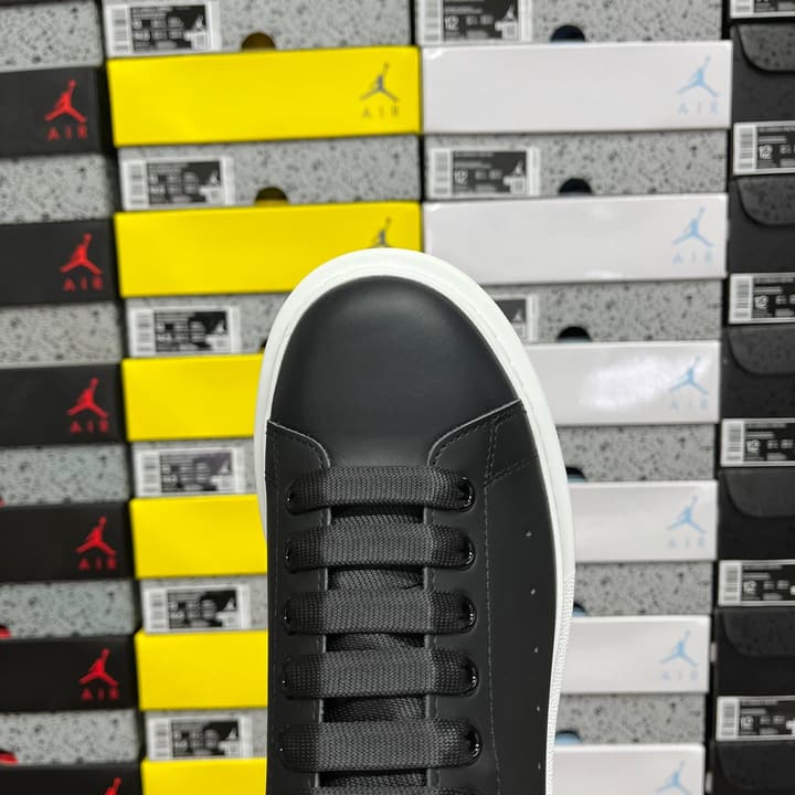 Alexander McQueen Oversized Low-Top Sneakers in All Black With White Sole