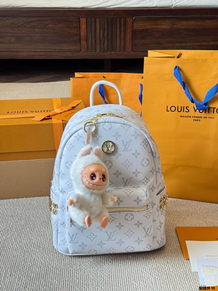 Louis Vuitton Monogram Mini Backpack in Monogram With Light Blue Charm
