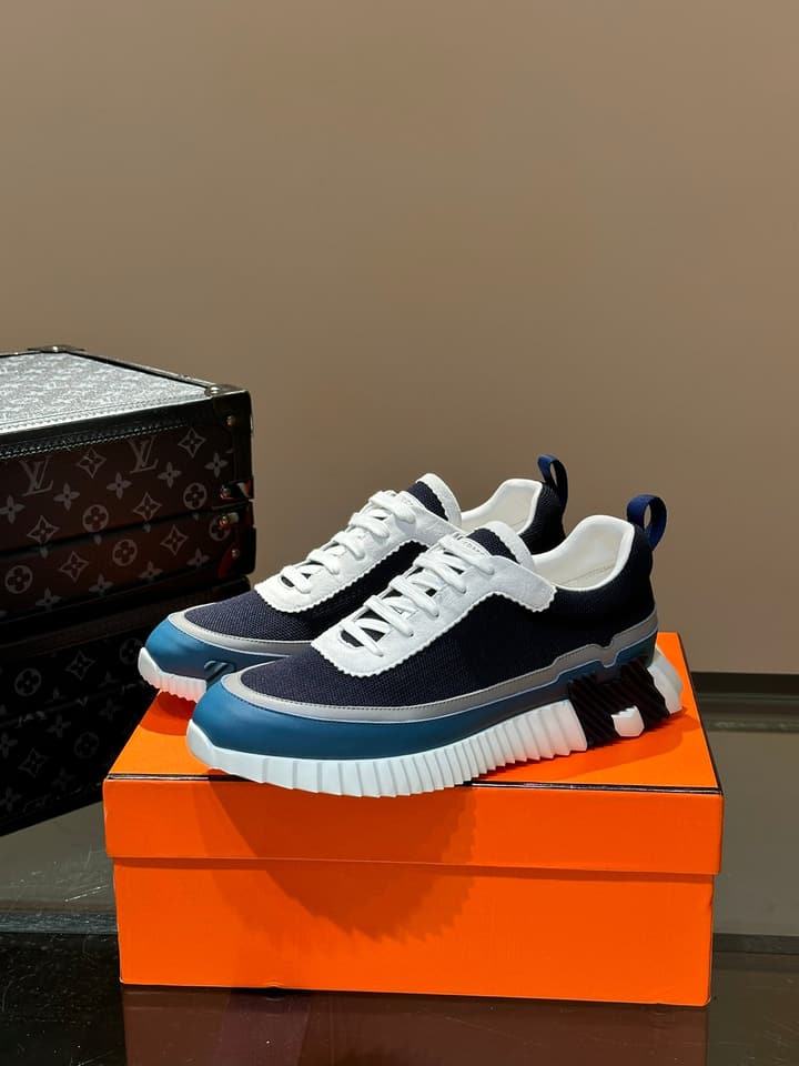 Hermès Bouncing Calfskin Mesh Sneakers in Black With White Stripe