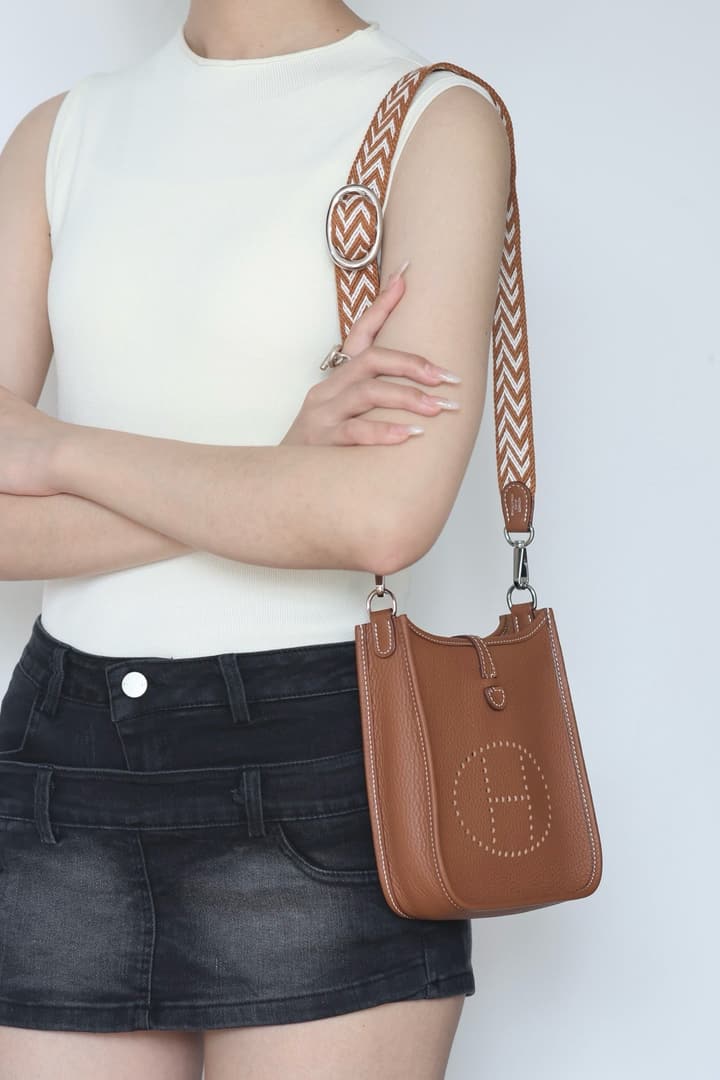Hermès Mini Evelyne TPM – Gold Brown in Gold Brown With Patterned Strap