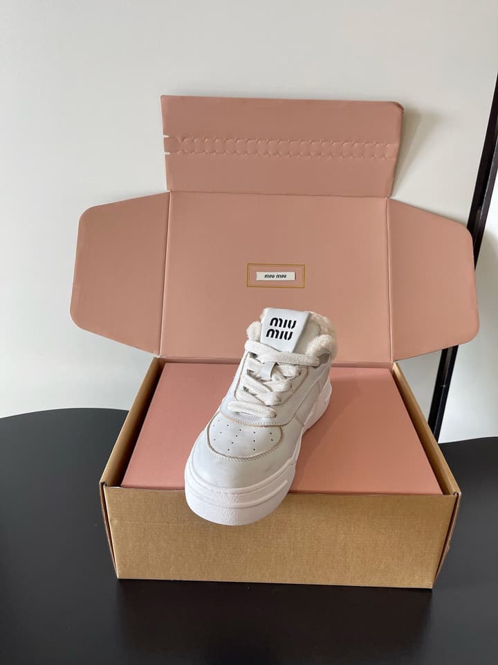 Miu Miu Distressed Retro German Training Sneakers in Distressed Off-white