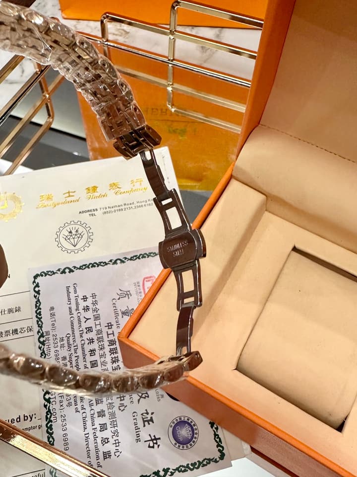 Hermès Small Square Luxury Watch in Dark Dial Patterned Gold Bracelet