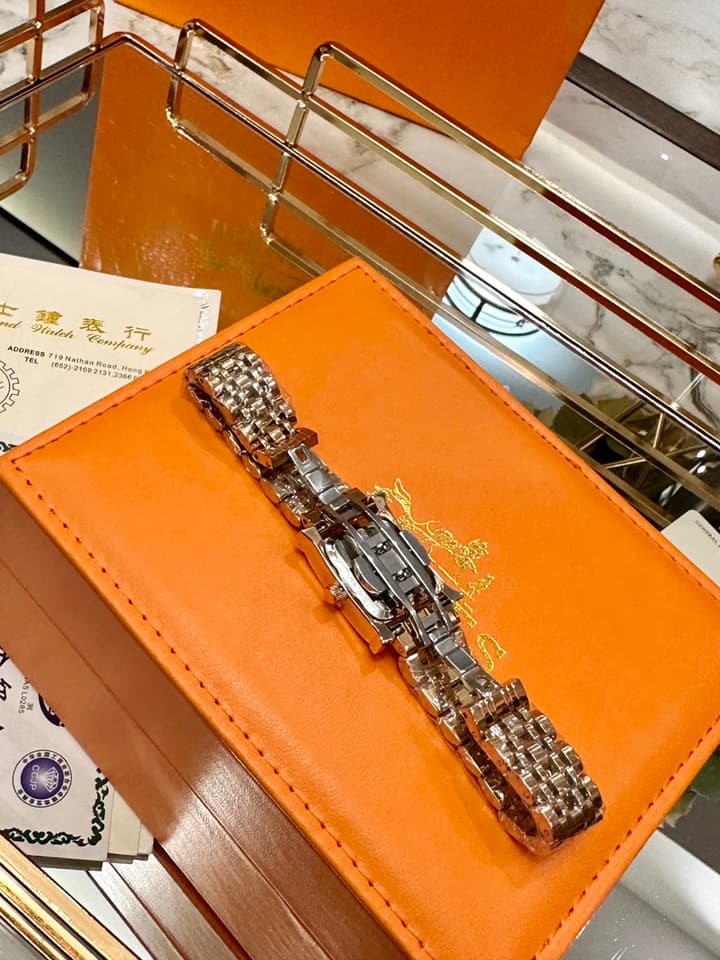 Hermès Small Square Luxury Watch in Dark Dial Patterned Gold Bracelet