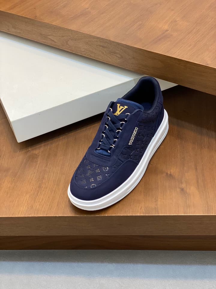 Louis Vuitton Embossed Calfskin Sneakers in Black