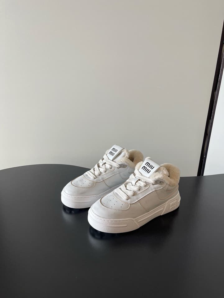 Miu Miu Distressed Retro German Training Sneakers in Distressed Off-white