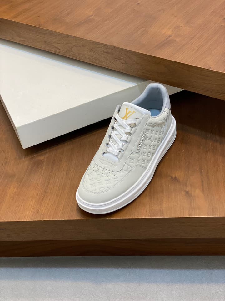 Louis Vuitton Embossed Calfskin Sneakers in Black