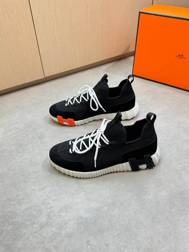Hermès Casual Sports Sneakers in Black With White Laces And Orange Sole