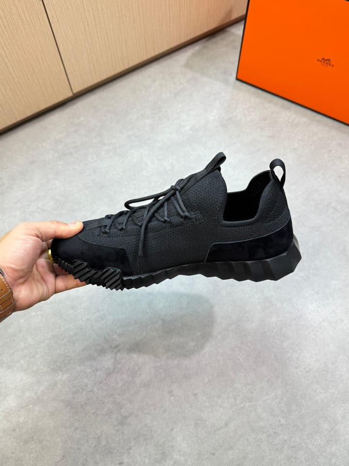 Hermès Casual Sports Sneakers in Black With White Laces And Orange Sole