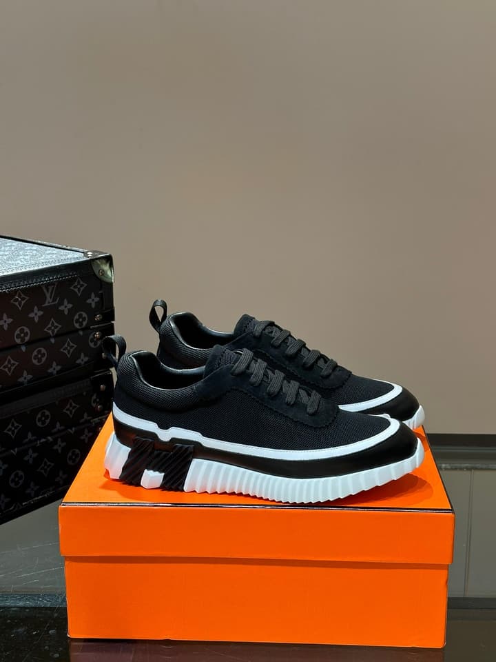 Hermès Bouncing Calfskin Mesh Sneakers in Black With White Stripe