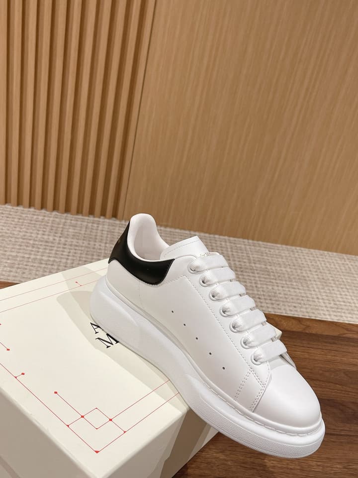Alexander McQueen Classic Versatile White Sneakers in White With Black Laces & Heel