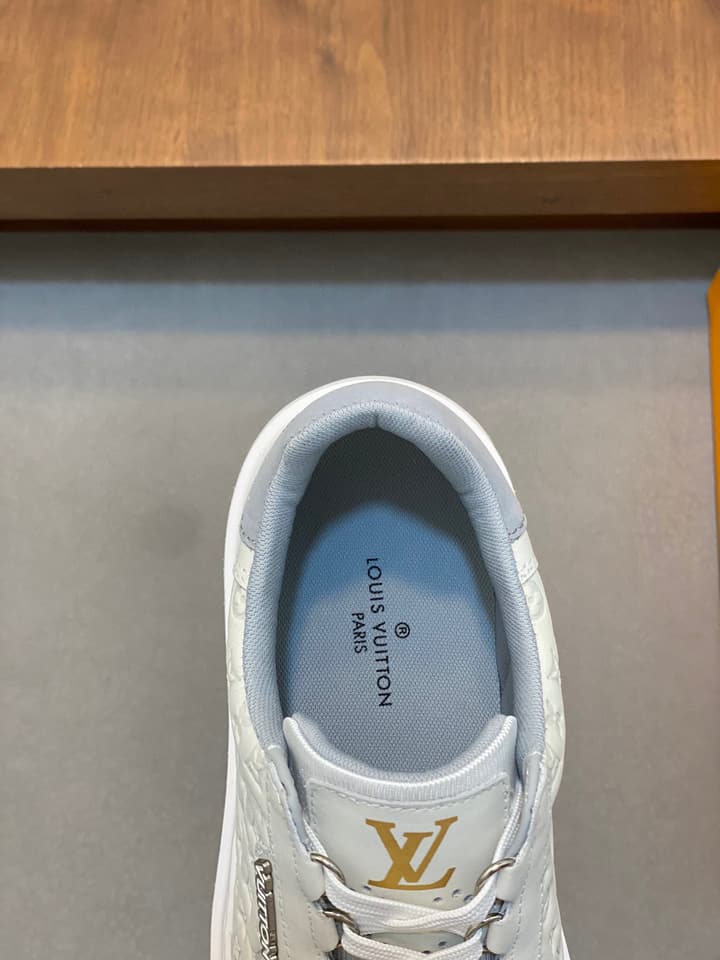Louis Vuitton Embossed Calfskin Sneakers in Black