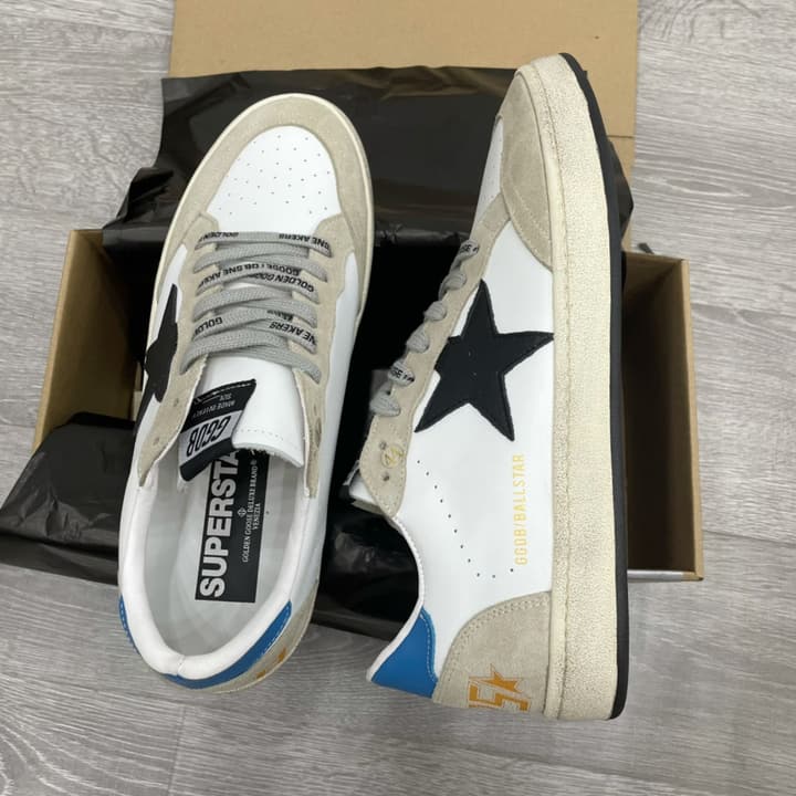 Golden Goose Ball Star Distressed Sneakers – 2023 Spring Collection in White Distressed With Blue Heel And Black Star