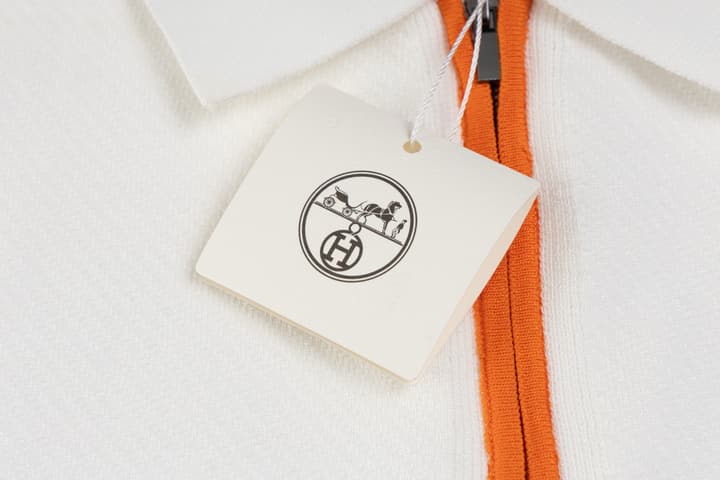 Hermès Retro Knitted Polo Shirt – SS24 in Black Polo With Orange Placket
