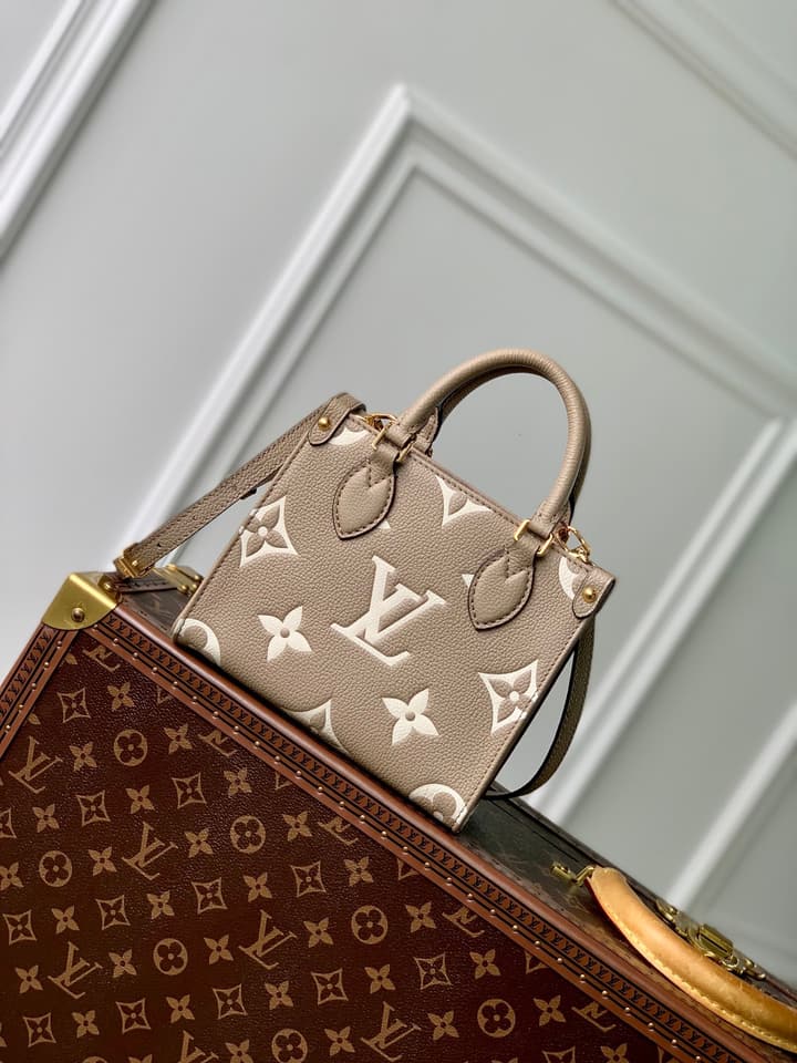 Louis Vuitton OnTheGo BB Monogram Empreinte Handbag in Beige And Cream Monogram