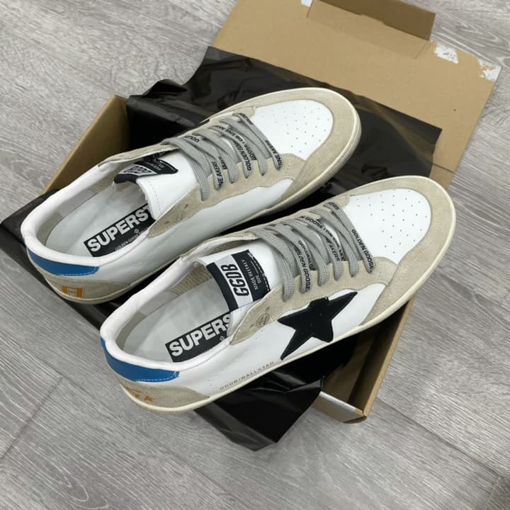 Golden Goose Ball Star Distressed Sneakers – 2023 Spring Collection in White Distressed With Blue Heel And Black Star