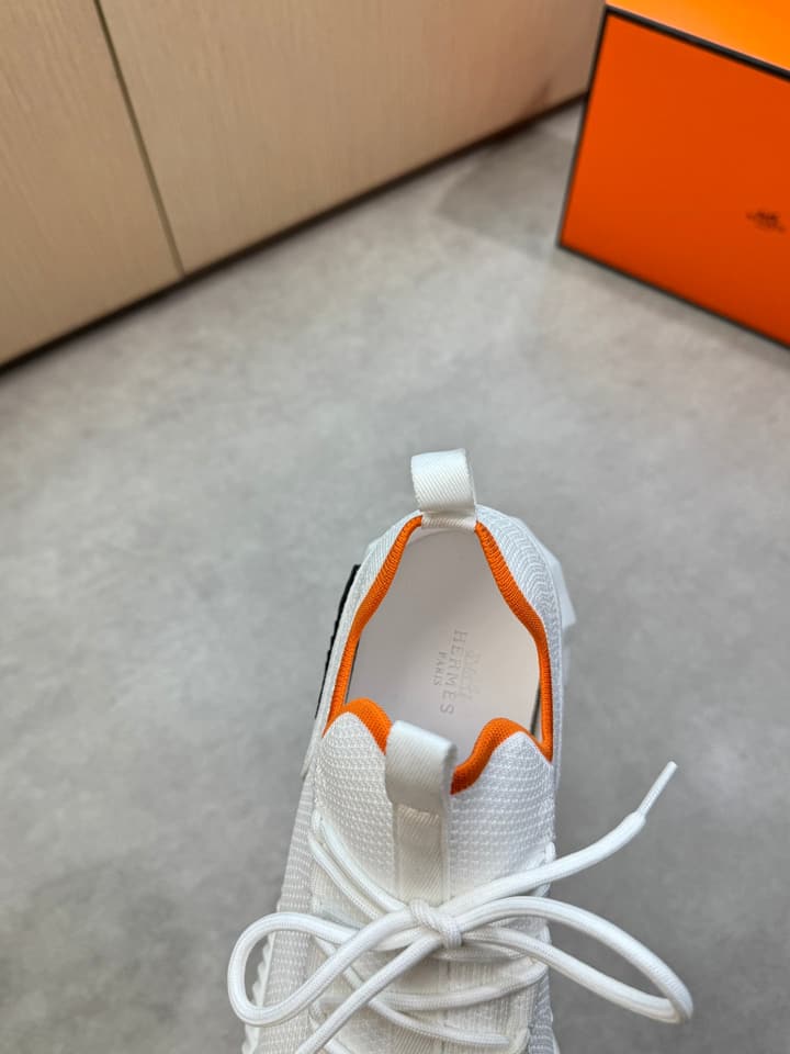 Hermès Casual Sports Sneakers in Black With White Laces And Orange Sole