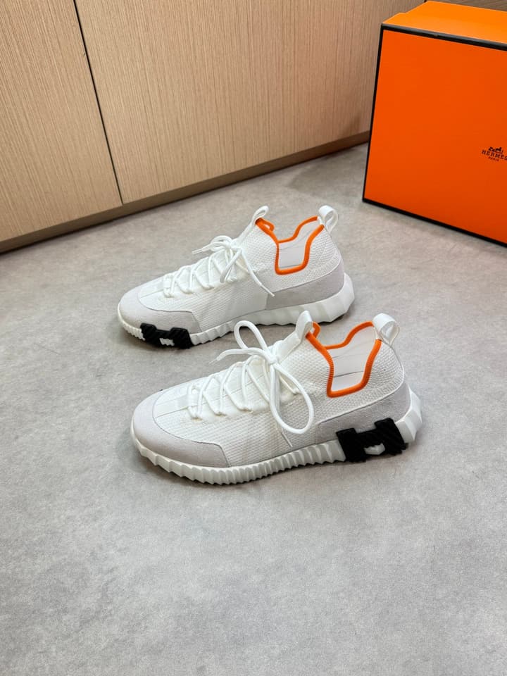 Hermès Casual Sports Sneakers in Black With White Laces And Orange Sole