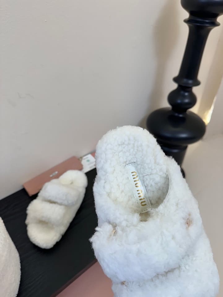 Miu Miu Sheepskin Mules in Black