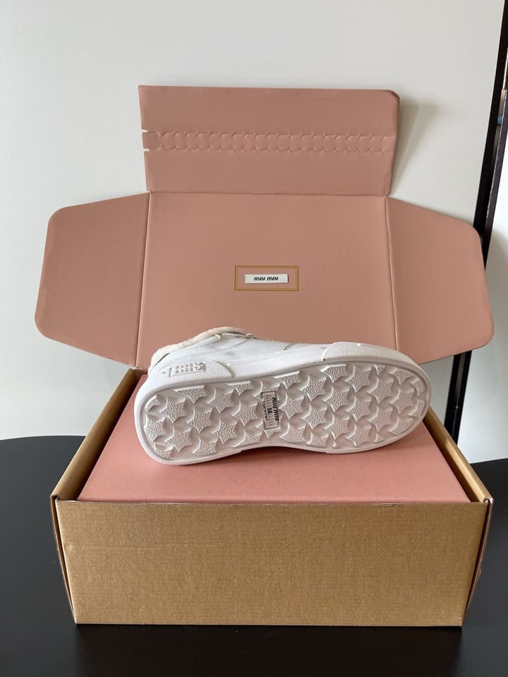 Miu Miu Distressed Retro German Training Sneakers in Distressed Off-white