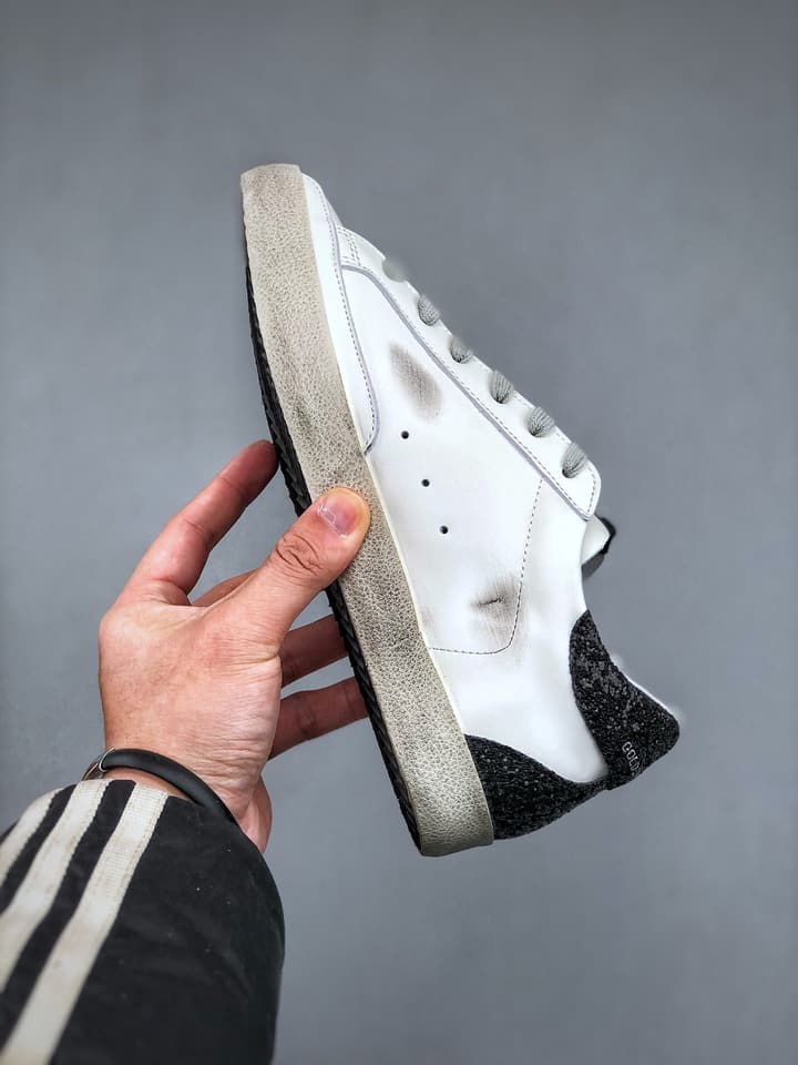 Golden Goose Distressed Sneakers in Gold