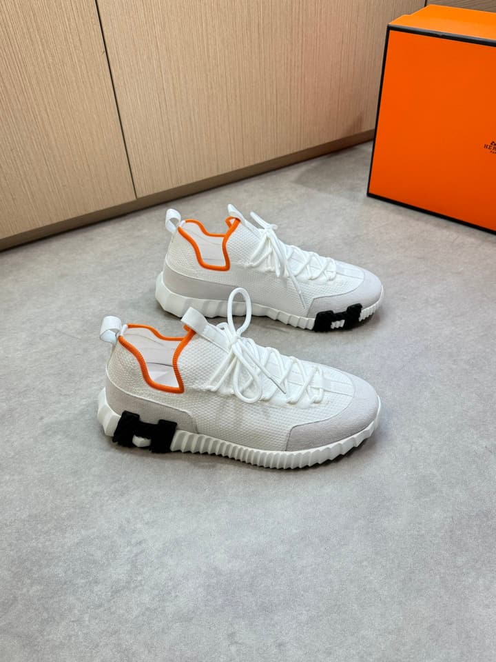 Hermès Casual Sports Sneakers in Black With White Laces And Orange Sole