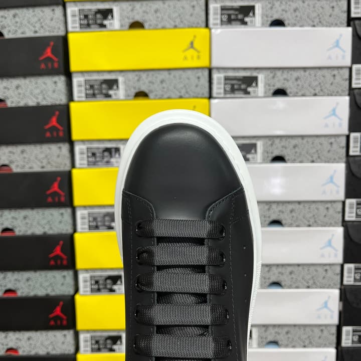 Alexander McQueen Oversized Low-Top Sneakers in All Black With White Sole