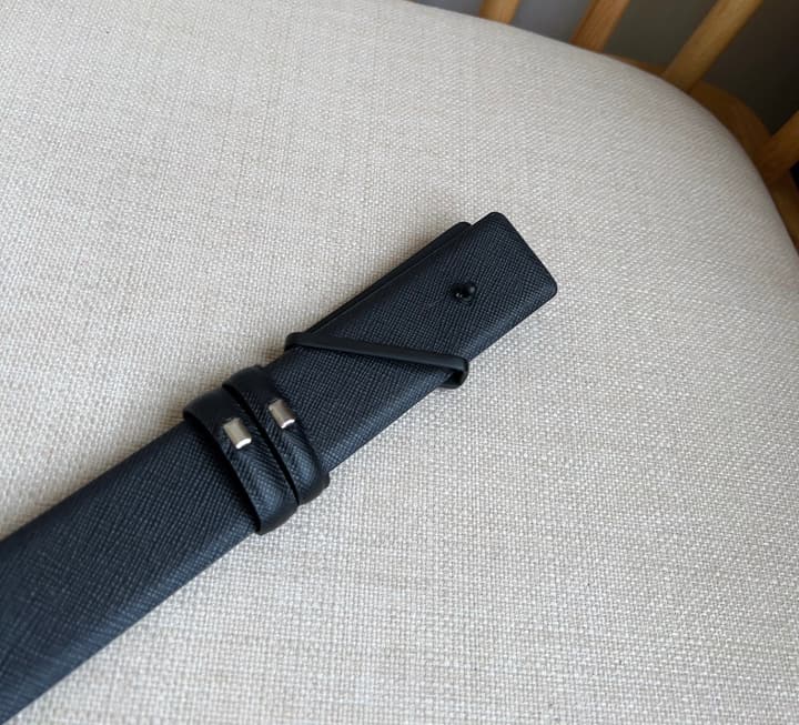 Prada Triangle Logo Buckle Belt in Black Textured Leather With Black Buckle