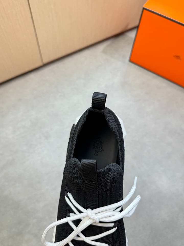 Hermès Casual Sports Sneakers in Black With White Laces And Orange Sole