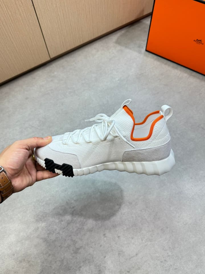 Hermès Casual Sports Sneakers in Black With White Laces And Orange Sole
