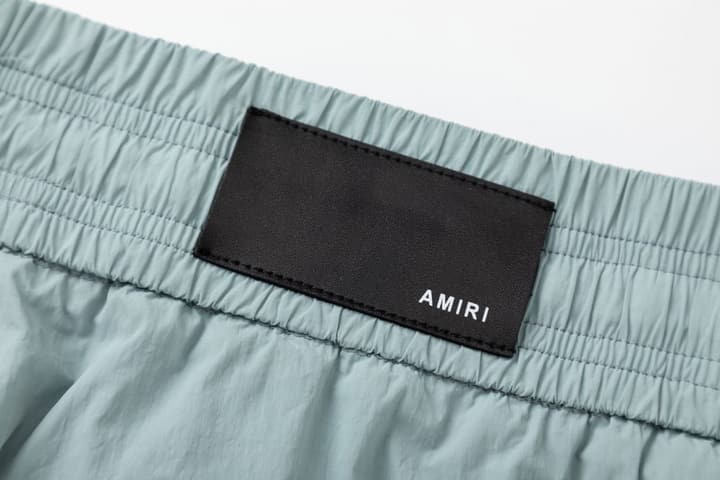 Amiri Logo Print Swim Trunks in Black
