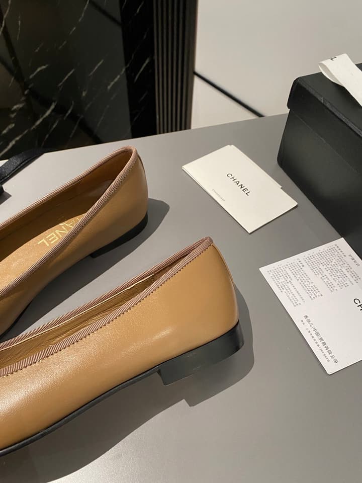 Chanel Classic Ballet Flats in Tan With Black Cap Toe