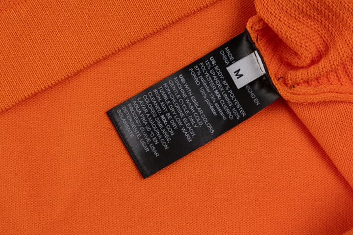 Hermès Retro Knitted Polo Shirt – SS24 in Black Polo With Orange Placket