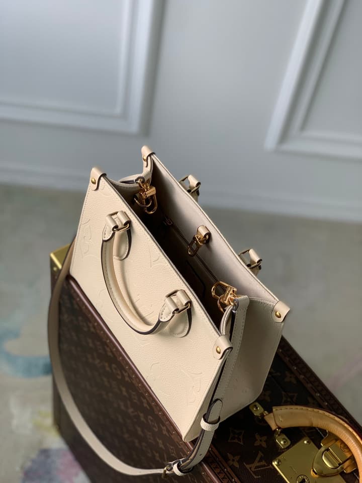Louis Vuitton OnTheGo Small Tote Bag in Cream Empreinte With Monogram Sides