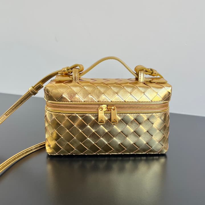 Bottega Veneta Intrecciato Vanity Case in Metallic Gold